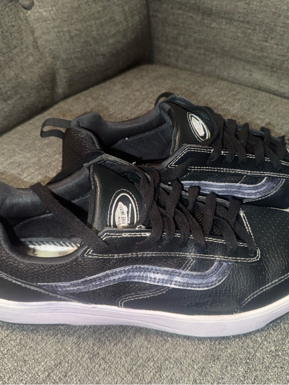 Vans Black Low-Top Sneakers with white stitching accents